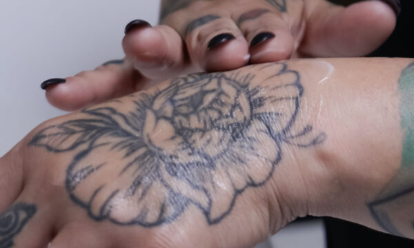 Rubbing the tattoo with cream